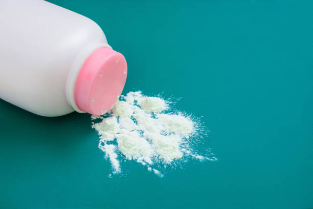 istock Baby talcum powder container on green background with copy space 1134001807