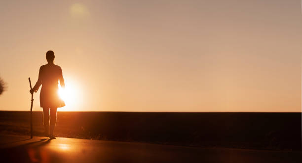 istock Pilgrim Woman at Sunset on st James way 1134001839