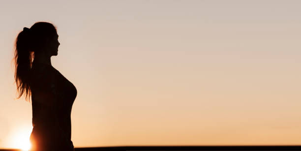 istock Silhouette of a woman with ponytail 1134001865
