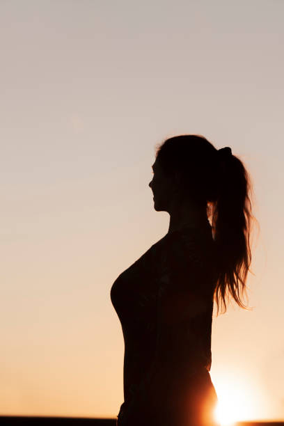 istock Silhouette of a woman with ponytail 1134001916