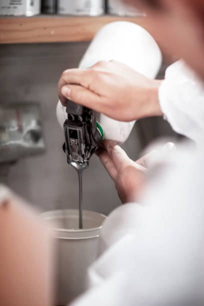 istock Car painting technician mixing paint 1134002250
