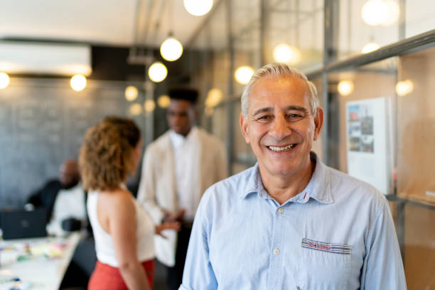 istock Senior businessman portrait at startup modern office 1134004906