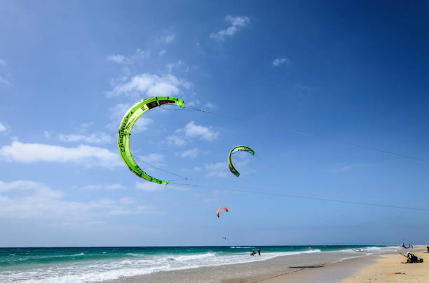 Sotavento beach, Fuerteventura, Canary Islands, Spain; May 5, 2018: Kites in the blue sky over Sotavento Lagoon with kite surfers training before the championships