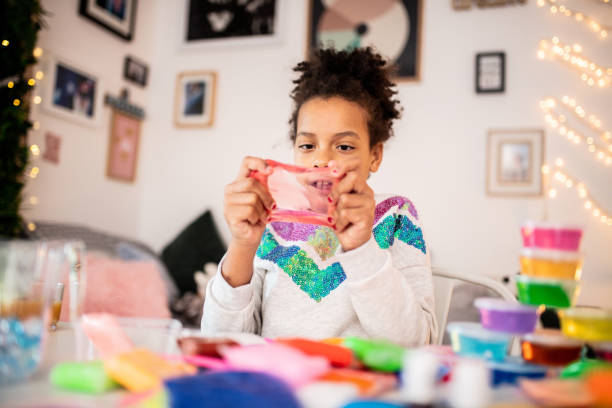 Cute girl playing with slime Little Girl Vlogging slimy stock pictures, royalty-free photos & images