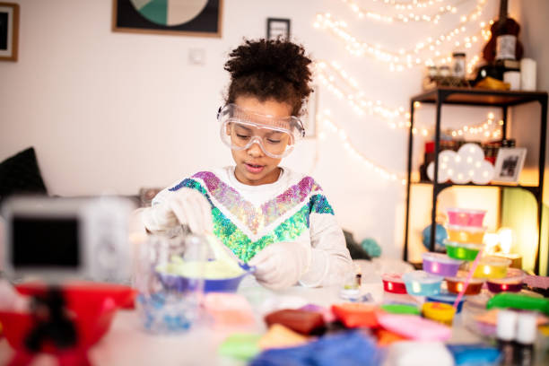 istock Cute girl playing with slime 1134007059