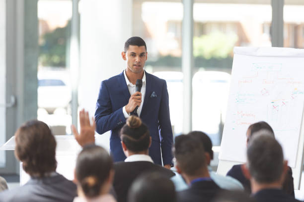 istock Male speaker speaking with microphone at conference 1134007197