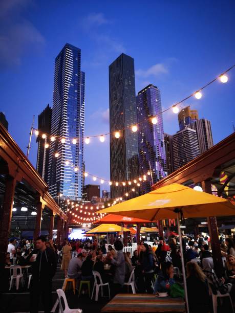 Night Food Market - Melbourne Melbourne, Australia: March 05, 2019: Ethnic food is sold at Queen Victoria Market Summer Night Market - every Wednesday throughout the summer season. traditionally australian stock pictures, royalty-free photos & images