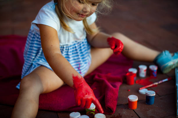istock Girl is painting 1134008024