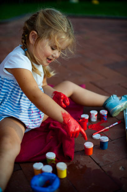 istock Girl is painting 1134008063
