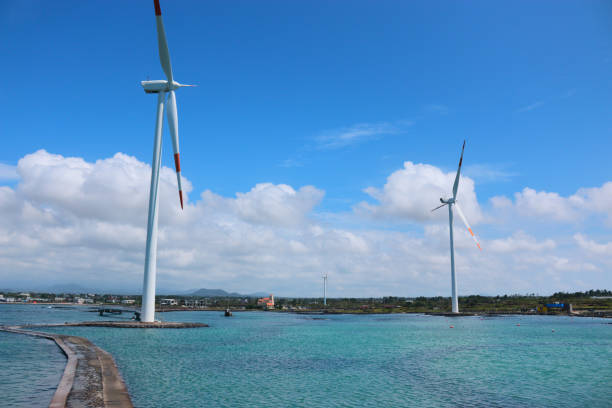 istock Offshore wind turbines, clean energy, sea, lighthouse, 1134010988