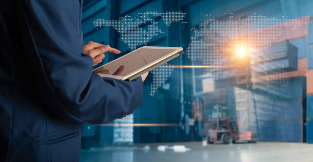istock Businessman manager using tablet check and control for workers with Modern Trade warehouse logistics. Industry 4.0 concept 1134011071