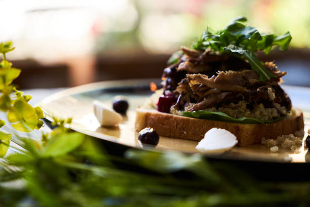 istock Breakfast toast bread with duck meat and quinoa, close-up. 1134013177