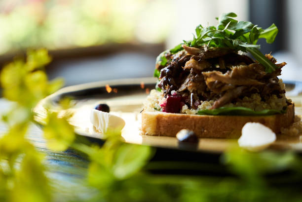 istock Breakfast toast bread with duck meat and quinoa, close-up. 1134013179