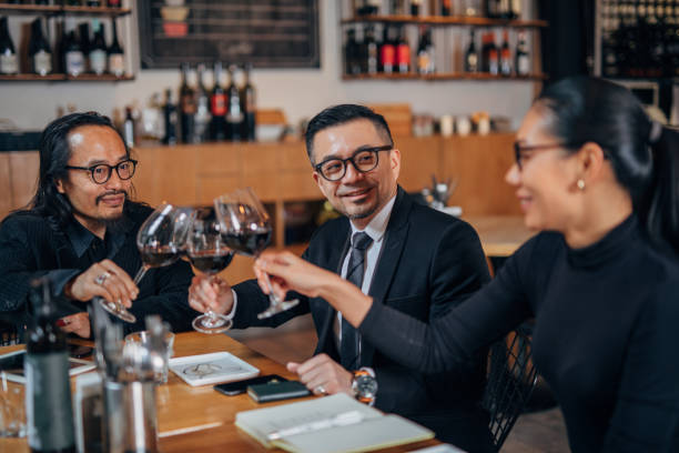 istock Business people drinking wine in restaurant 1134013679
