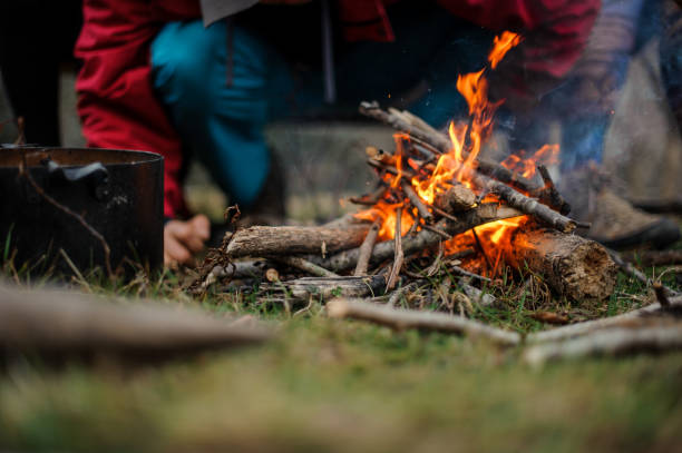 istock Man standing near the campfire in the forest 1134015135