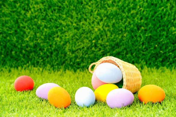 istock Easter eggs in the basket on green grass 1134015254