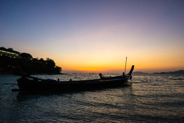 istock silhouette of a boat at sunset, summer beach landscape 1134015964