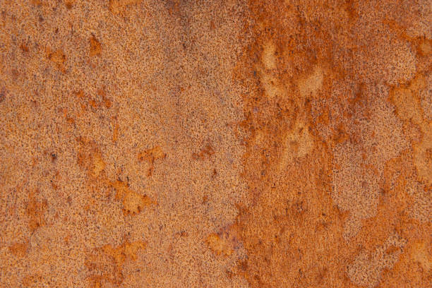 istock Old Distressed Brown Terracotta Copper Rusty Stone Background with Rough Texture Multicolored Inclusions. Stained Gradient Coarse Grainy Surface 1134016183