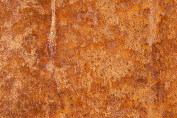istock Old Distressed Brown Terracotta Copper Rusty Stone Background with Rough Texture Multicolored Inclusions. Stained Gradient Coarse Grainy Surface 1134016856