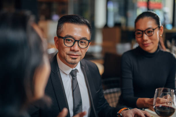 istock Elegant business people in restaurant 1134017008