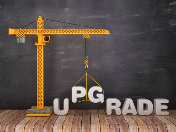 istock Tower Crane with UPGRADE Word on Chalkboard Background - 3D Rendering 1134017302