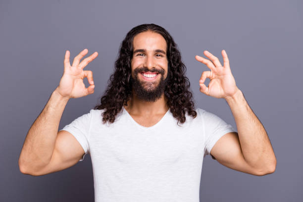 istock Portrait of his he nice cool groomed attractive cheerful cheery optimistic glad wavy-haired guy showing two ok-sign isolated over gray violet purple pastel background 1134018498