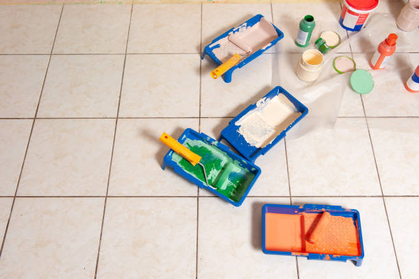 Painting tools for home concstructions and repair on tiled floor