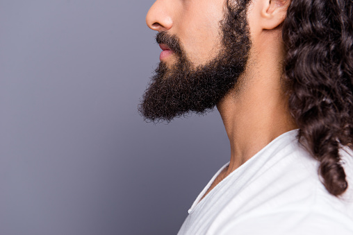 Close-up cropped profile side view portrait of his he nice well-groomed attractive calm wavy-haired guy mustache big beard isolated over gray violet purple pastel background.