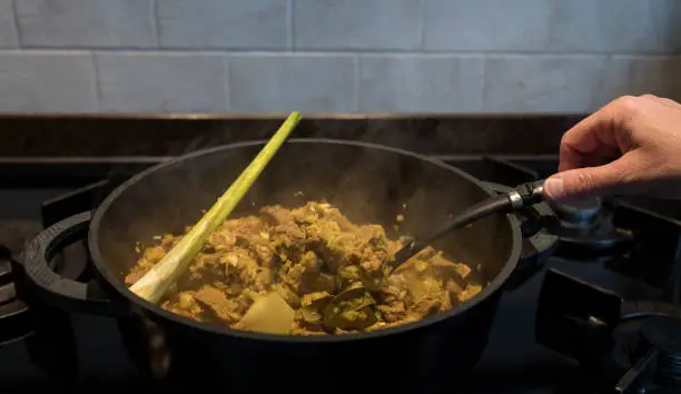 Photo of stir in the pan with rendang