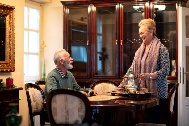 istock Caring wife bringing carafe of tea 1134020191