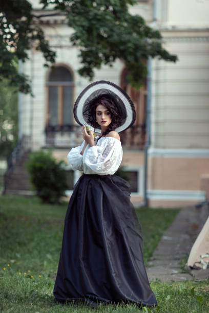 istock Beautiful brunette in a big black and white hat 1134020504