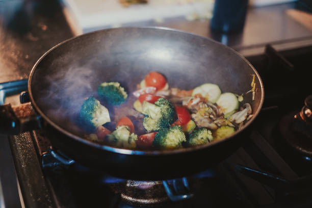 istock Various vegetables cooking in frying pan on the stove 1134021507