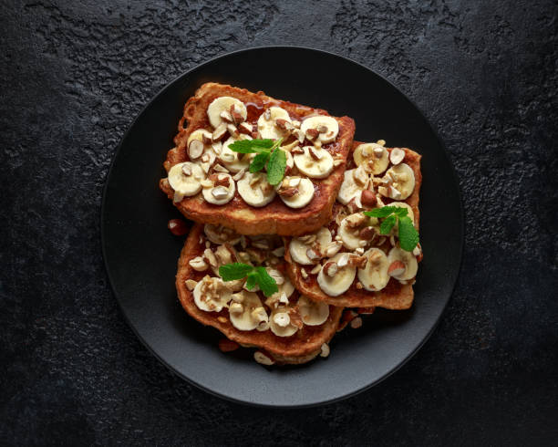 istock French cinnamon toast with banana, nuts and hazelnut, honey. 1134022139