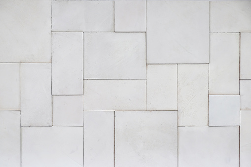 Close up wall cladding of white palimanan stone tile backgrounds