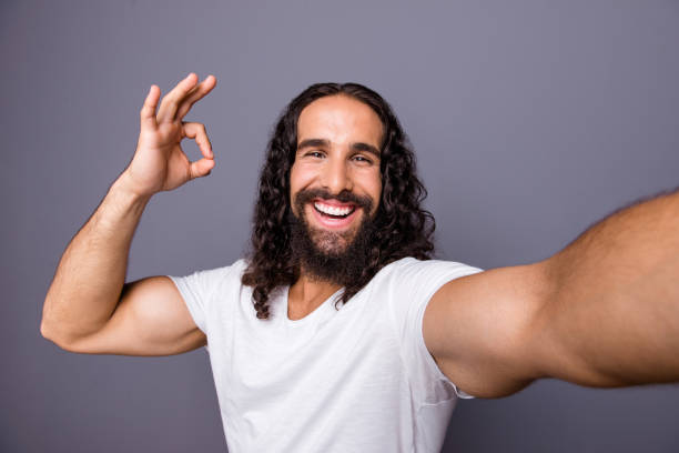 istock Self-portrait of his he nice trendy attractive cheerful optimistic glad wavy-haired guy showing ok-sign cool decision advert ad isolated over gray violet purple pastel background 1134022622