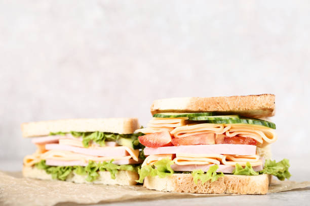 istock Sandwiches with ham and vegetables on gray background 1134024255