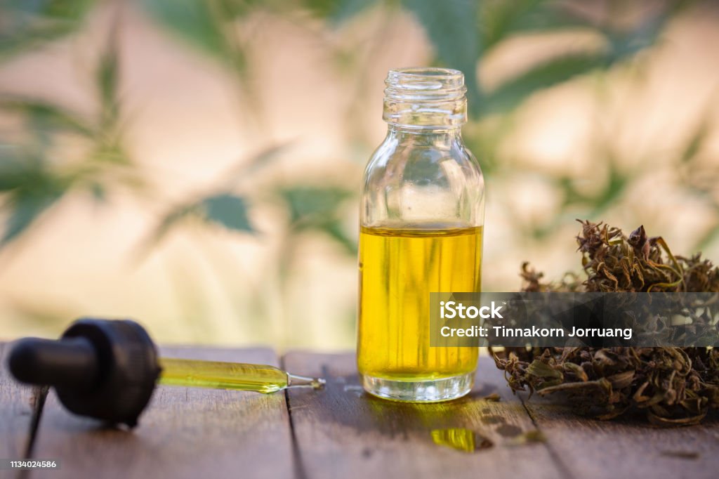 Hemp oil, Marijuana oil bottle, cannabis oil extracts in jars, medical marijuana, CBD oil pipette. Cooking Oil Stock Photo