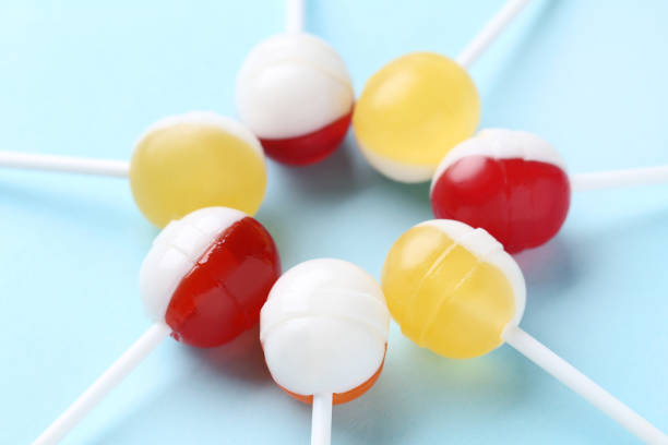 istock Sweet lollipops on blue background 1134025981