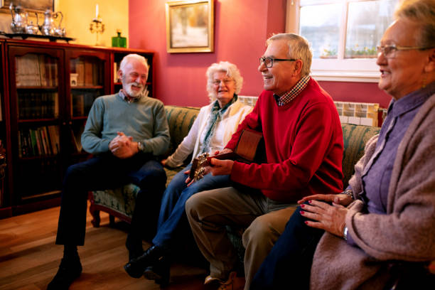 istock Old folks playing guitar and singing 1134026104