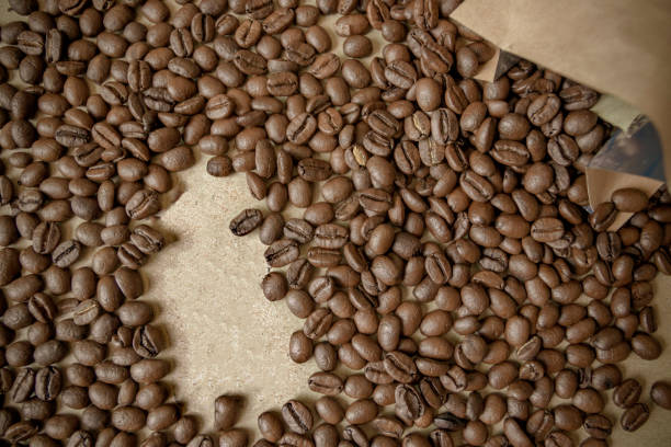 istock Roasted coffee beans on wooden table 1134026989