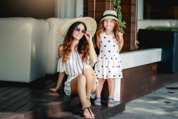 istock Mother and daughter in a hat during the summer walks. 1134028887