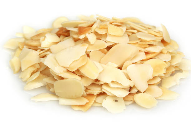 istock Heap of sliced almonds isolated white 1134030017