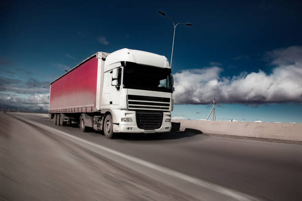istock truck on road  in winter 1134030410