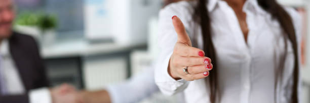 istock Woman in suit give hand as hello in office 1134030455