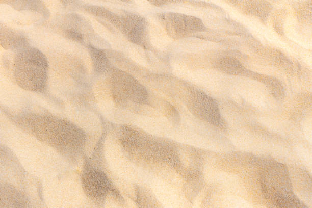 istock Fine beach sand in the summer sun. Sand texture on the beach 1134030540