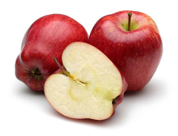 istock Whole and half red apples isolated on white 1134031896