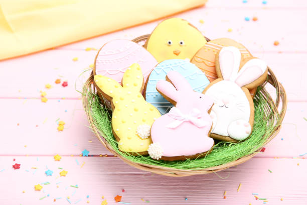 istock Easter gingerbread cookies in basket with sprinkles on wooden table 1134036145