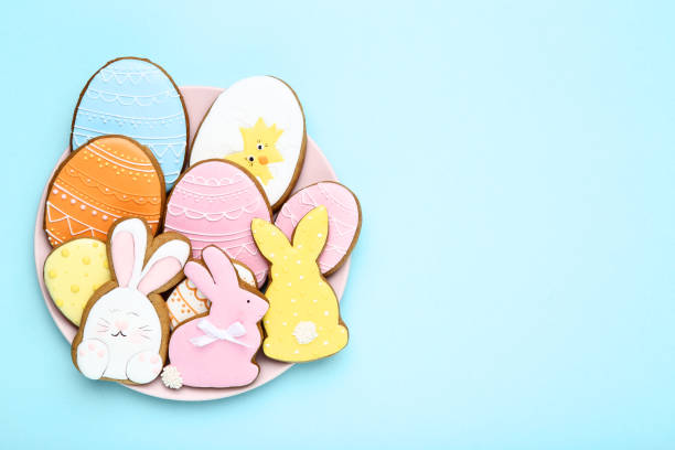istock Easter gingerbread cookies in plate on blue background 1134036175