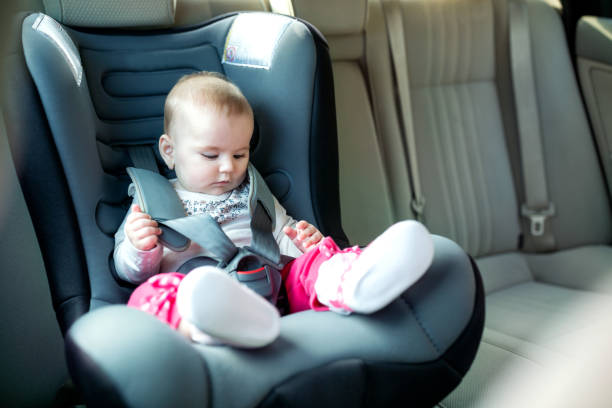 istock Baby exploring her car seat 1134036658