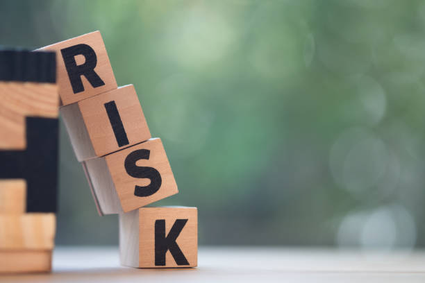istock Risk assessment, decision to accept business result in uncertainty, unpredictable situation concept, cube wooden block with alphabet building the word RISK. 1134036819